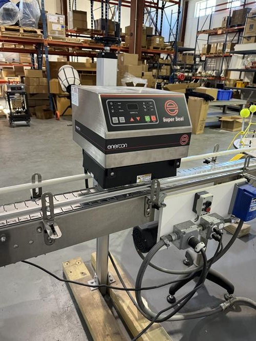 Enercon model Super Seal 75 induction sealer mounted on conveyor