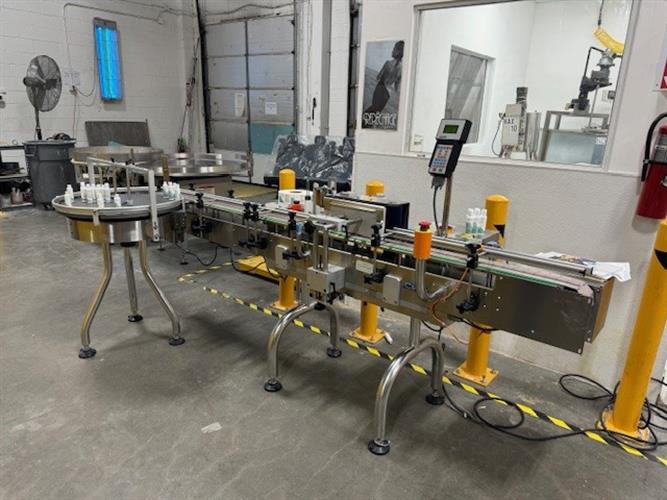 CVC model 300 wraparound pressure sensitive labeler with 28" accumulating table