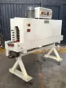 Devekmatic shrink tunnel for bottle labels