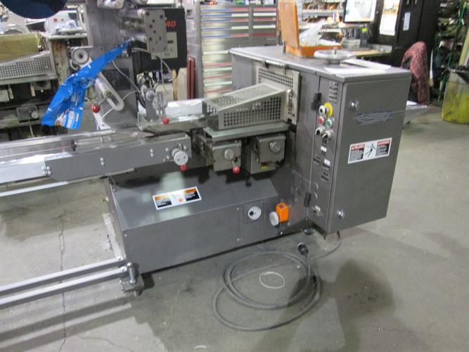 Doboy Mustang IV Horizontal Flow wrapper with Card Feeder
